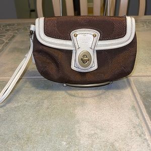 Coach brown wristlet. Excellent used condition.